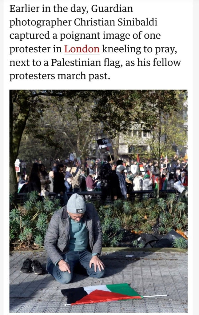 Earlier in the day, Guardian photographer Christian Sinibaldi captured a poignant image of one protester in London kneeling to pray, next to a Palestinian flag, as his fellow protesters march past.