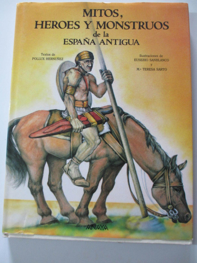 Cover of a book with the title "Mitos, héroes y monstruos de la España Antigua" (Spanish for "Myths, heros and monsters of Ancient Spain"). It shows an Iberian warrior riding a horse and carrying ancient weapons. Texts by: Póllux Hermúñez. Illustrations by: Eusebio Sanblanco and María Teresa Sarto. Publishing house: Anaya.