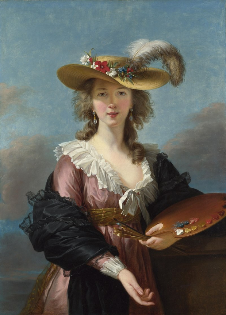 Vigée Le Brun's self portrait painting. She is facing the viewer, wearing a straw hat decorated with flowers and a feather. Her dress is pink with white ruffles, and there is a dark shawl wrapped around her arms. She is holding a handful of brushes and a painting palette.