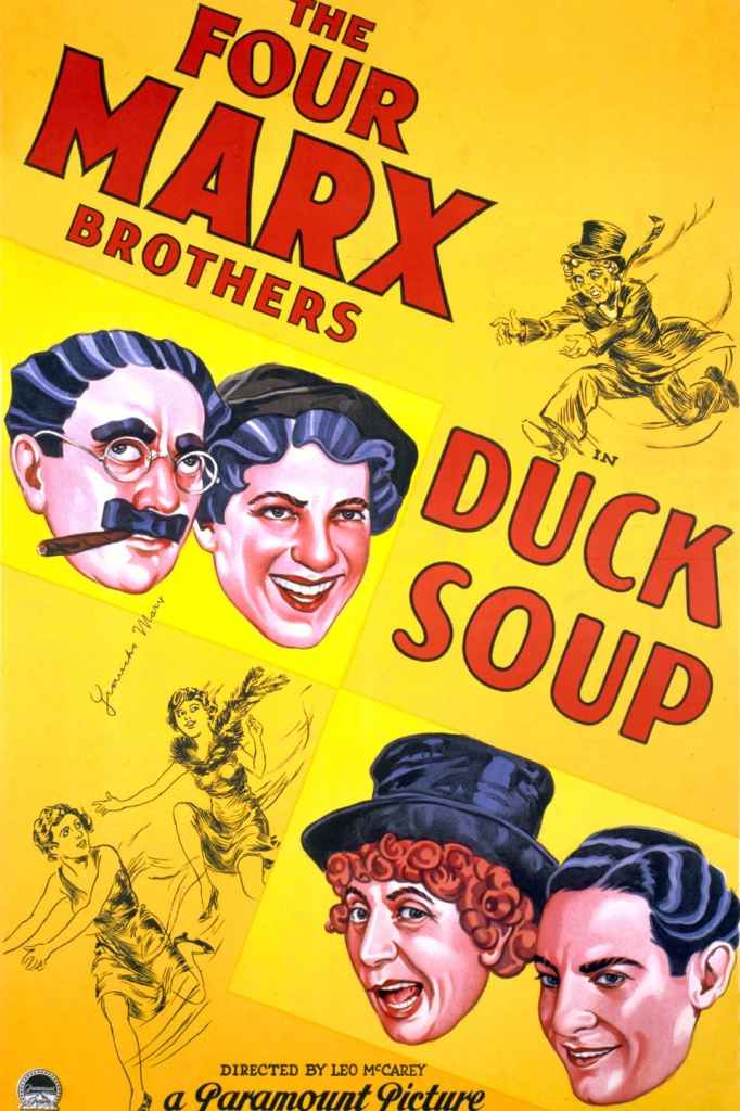 movie poster for The Four Marx Brothers in Duck Soup -- a yellow background with color images of Groucho, Chico, Harpo and Zeppo. Directed by Leo McCarey, a paramount picture