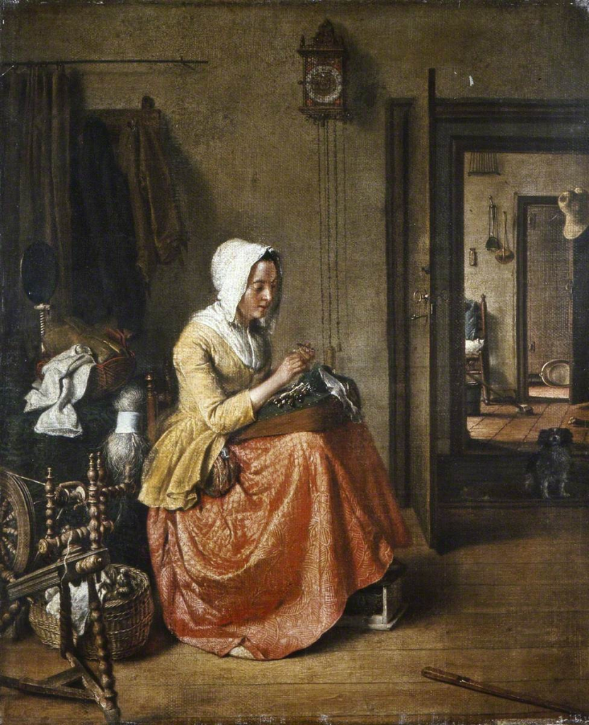 An 18th century oil painting of a woman making lace on a lace maker's pillow with a little wooden cube thing under her feet just peeking out from her quilted skirts or petticoats. She is wearing a tan jacket, white linen cap, a fichu tucked into her neckline and a pocket. There's a spinning wheel next to her, assorted fabrics and rovings waiting, and in the background there is a little dog sitting and watching, a clock with very long mechanism pulleys, and the view through a series of rooms through multiple doorways. There's a wash basin, ladles, hints of what the rooms may be. It's a slightly dark little painting, but quite realistic, visually striking and pleasant in a structured way. The woman with her tan jacket and salmon red skirt is the only spot of colour and the focus.