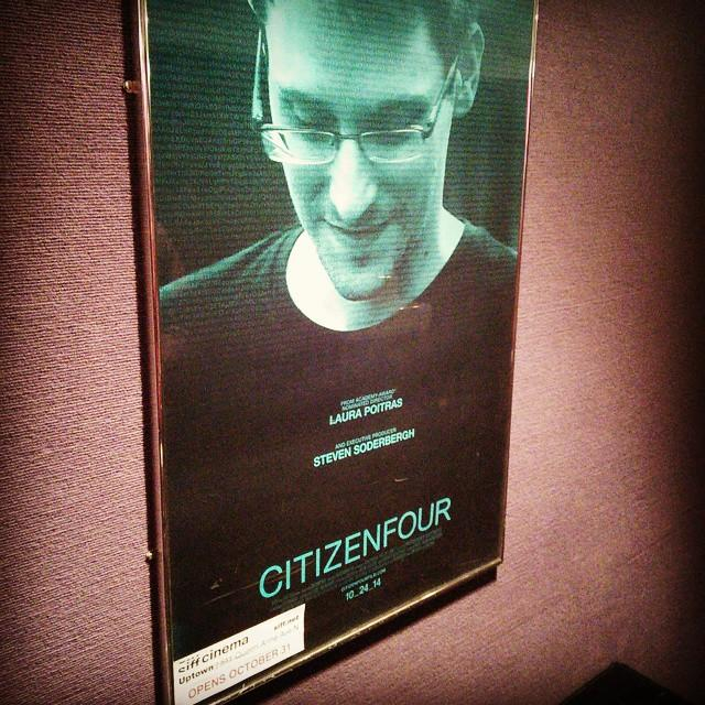 a movie poster of CITIZENFOUR showing Edward Snowden in a green hue