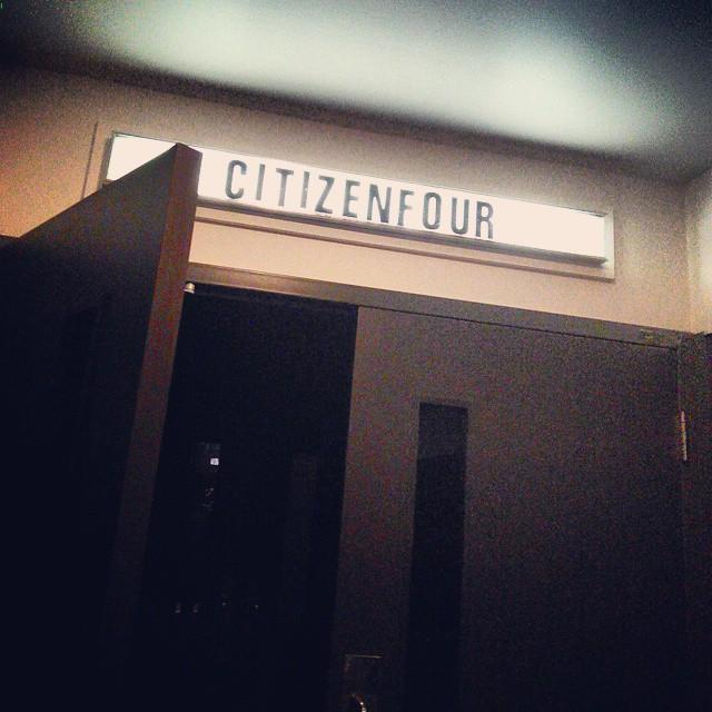 walking into a movie theater with CITIZENFOUR written above the doorway, the left door is open and the right door is closed