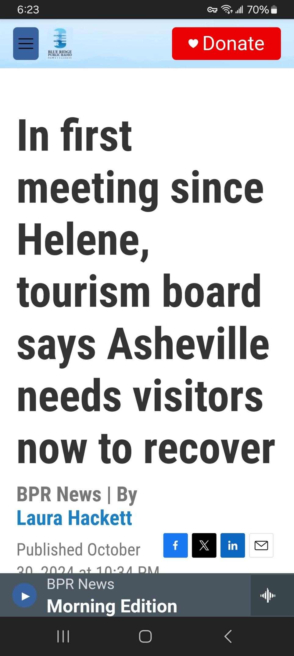 News headline about Asheville tourism