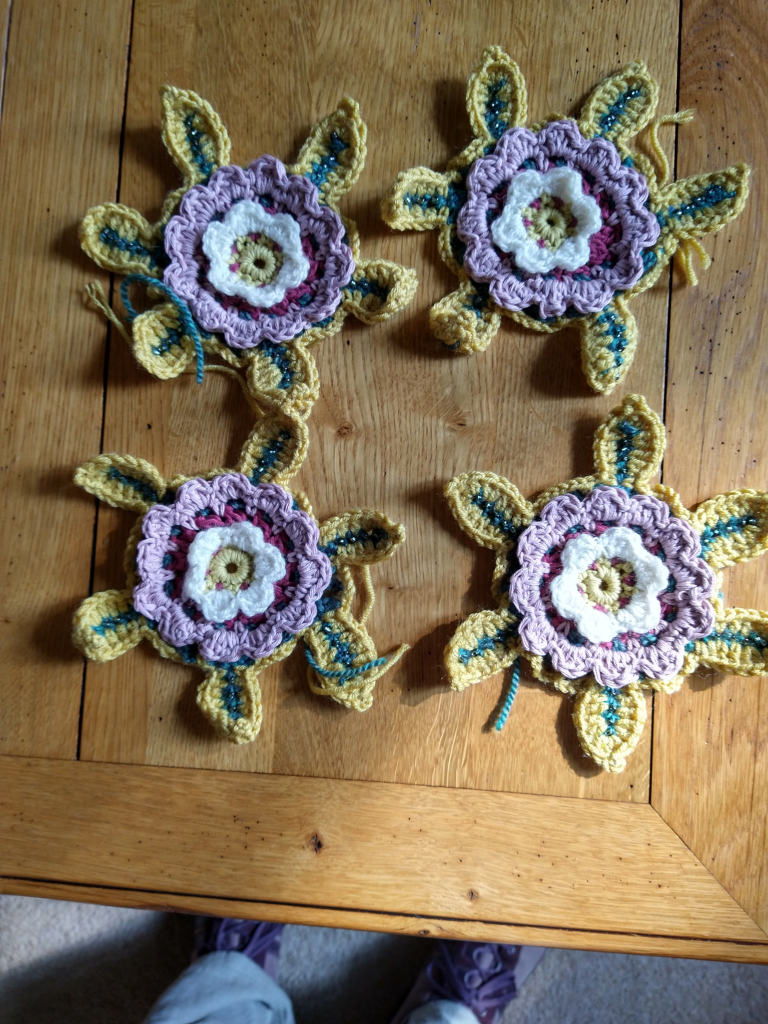 Four legacy motif crochet flowers each has six leafs with beads 