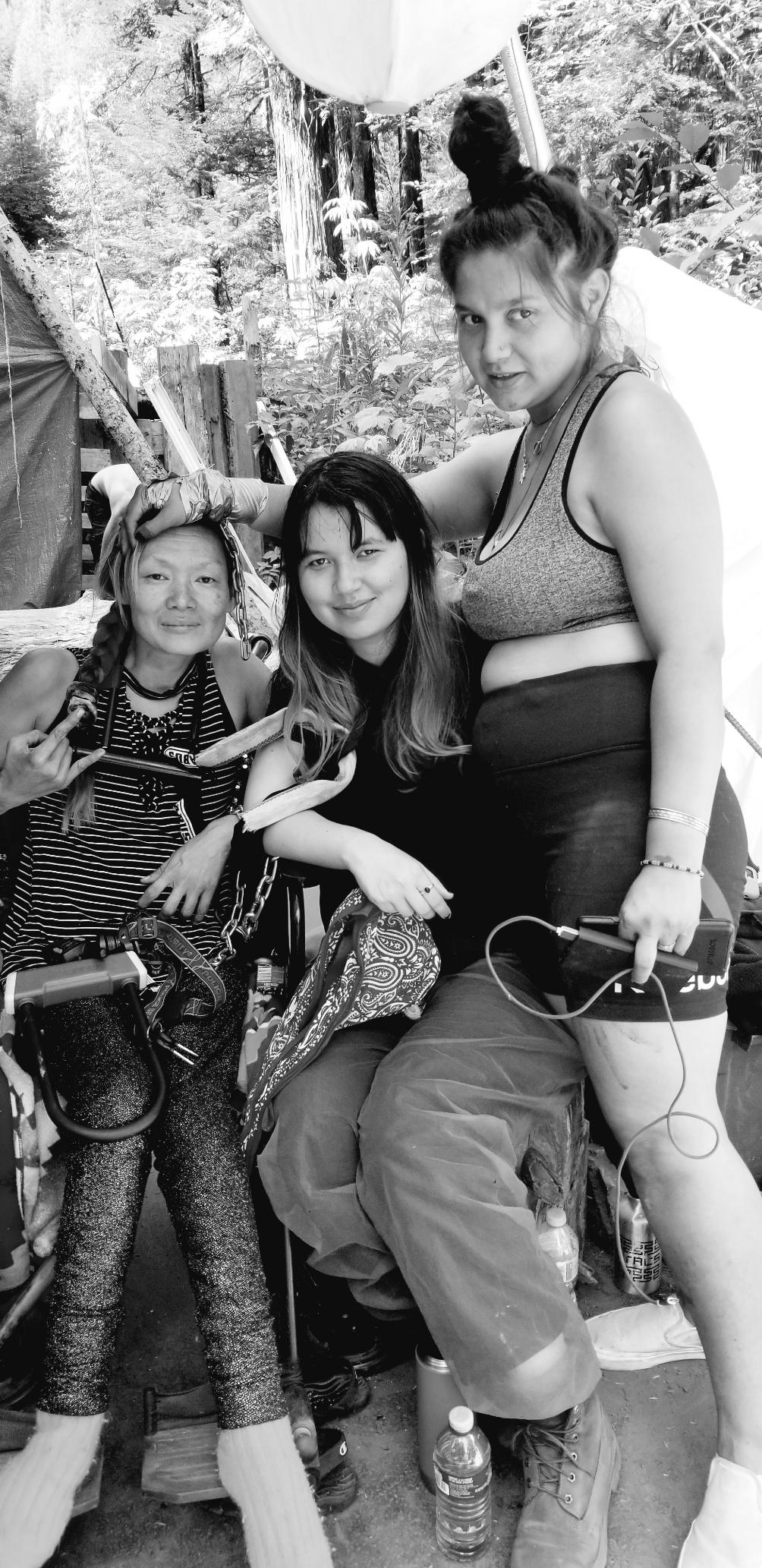 Me & Filipino comrade chained up with our Indigenous Pacheedaht sister-friend supporting.
Black and white photo.