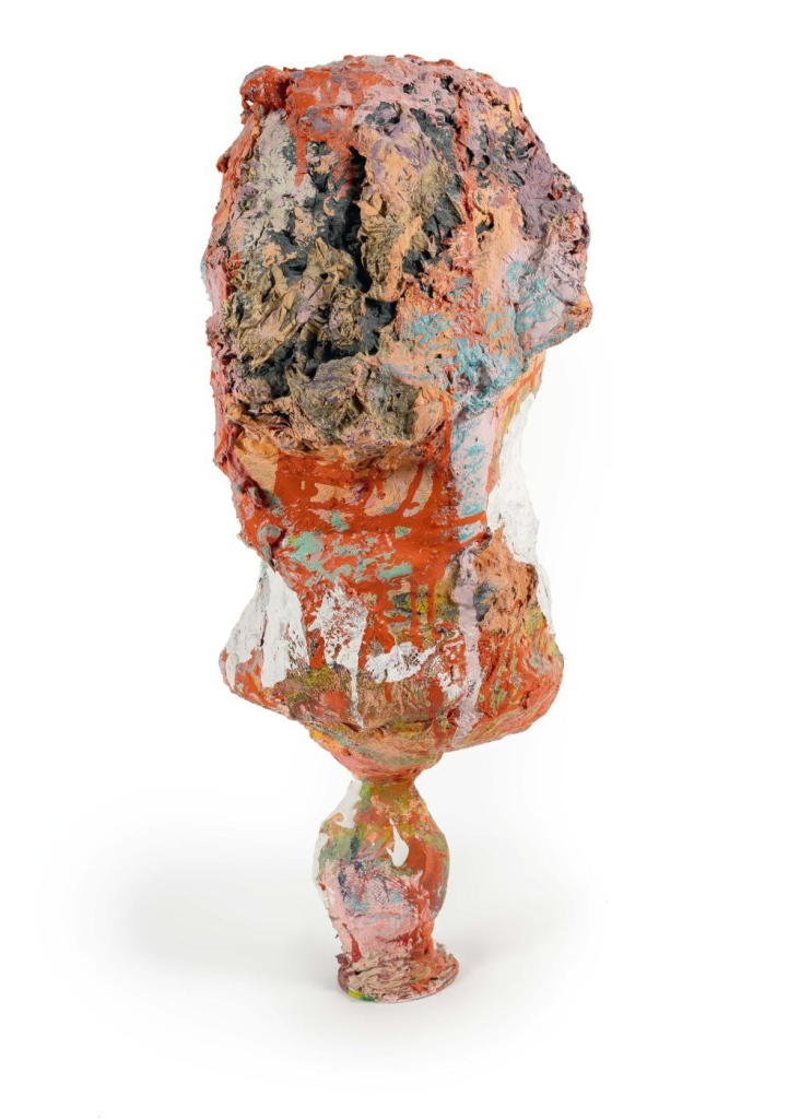 Abstract, textured sculpture with drippy orange, peach, and white colors