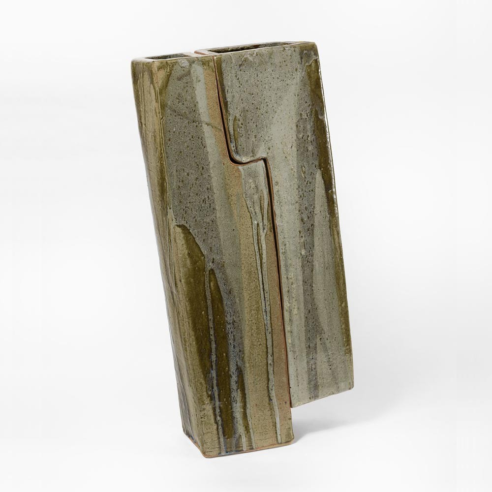 Ceramic vase in a slanted rectangular shape with muted brown-green glazes