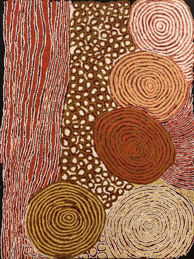 Abstract Dreaming painting of and large concentric circles in red, white, brown, and orange