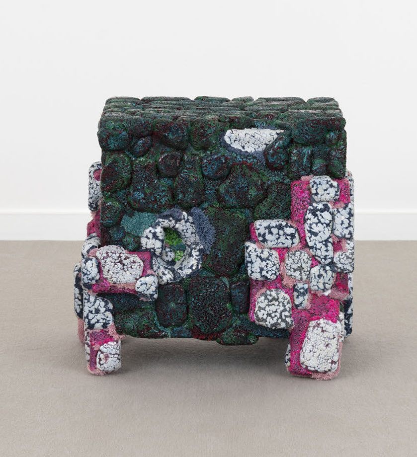 Cube shape with deep green stones and mottled pink and white details