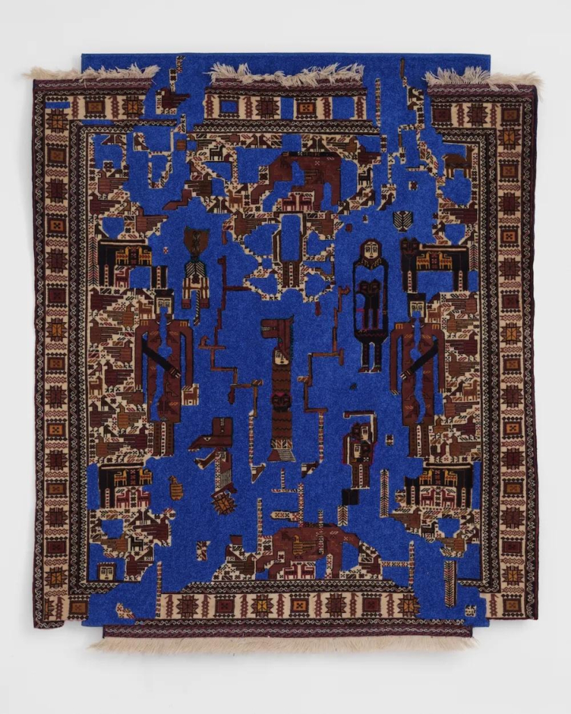 Hanging textile rug with abstract elements in blue, cream, and brown