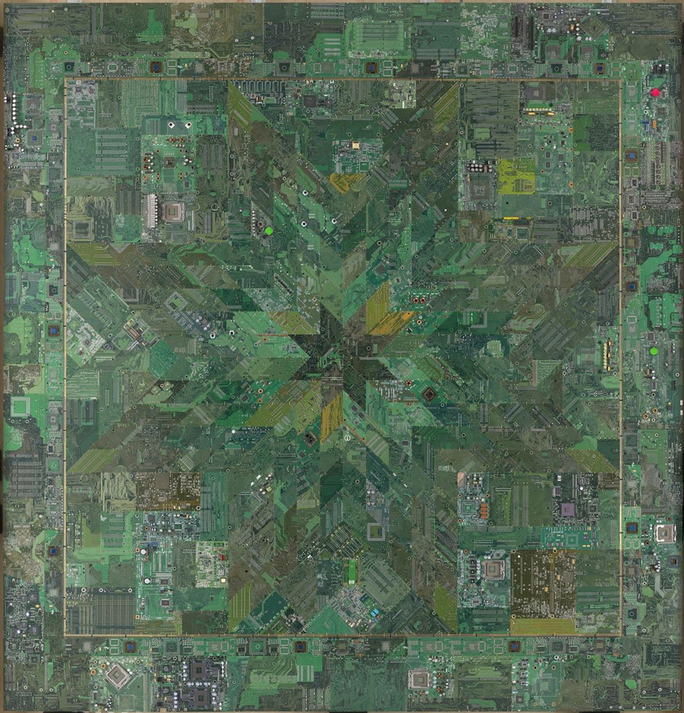 Hanging quilt with a star pattern in a green palette, made with circuit boards