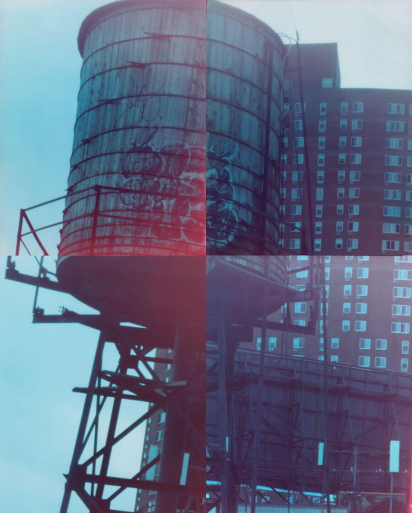 Slightly blurry composite image of four photos, making up a rusty water tower with an apartment building and scaffolding behind it