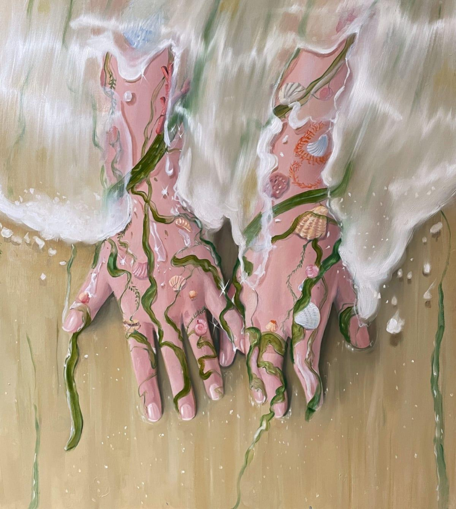 Painting of two white hands lying flat on a beach, arms covered by the surf, with seaweed and shells covering the hands and wrists