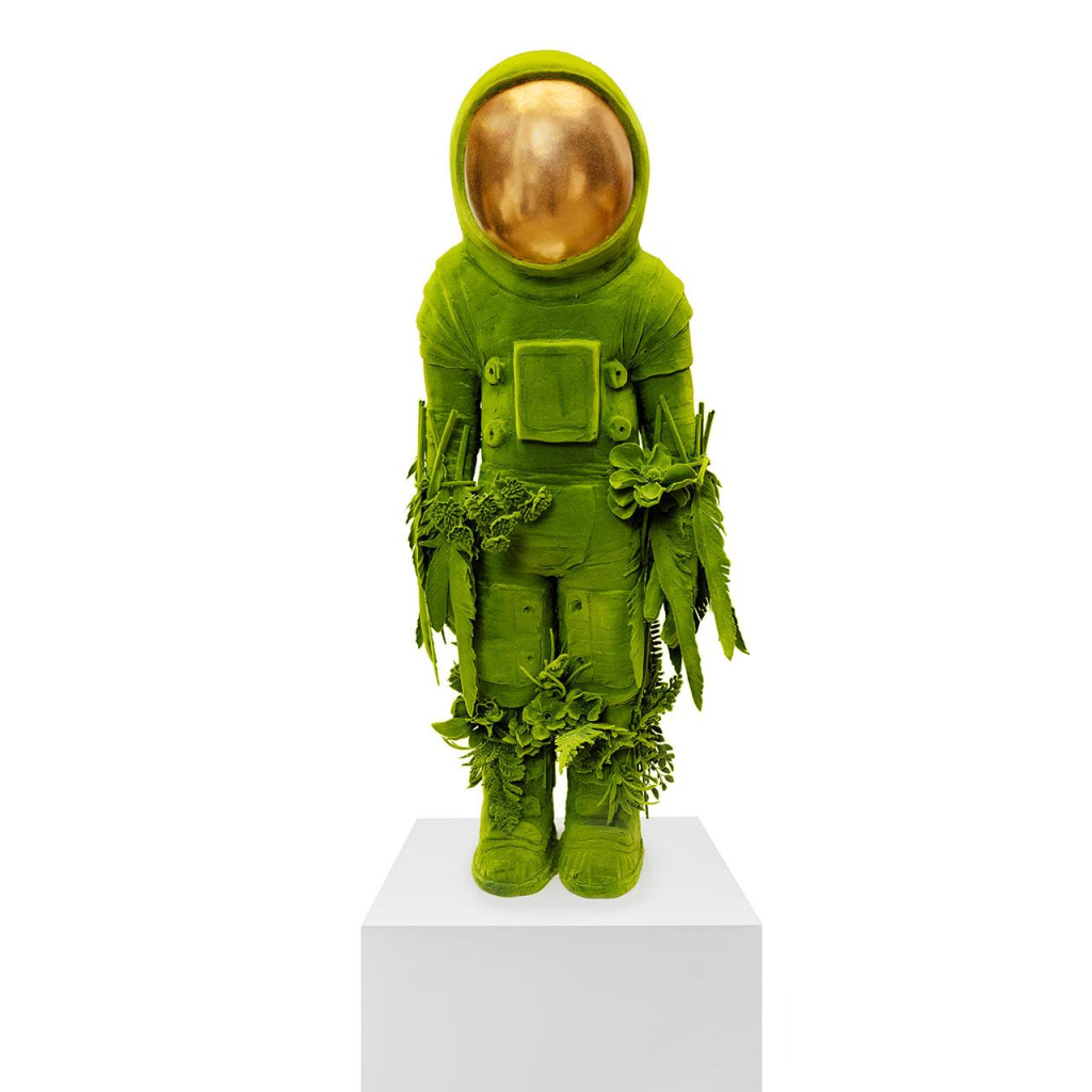 Sculpture of a childlike figure wearing a spacesuit with a gold visor, everything else render in a bright green hue, with carved organic forms emerging over their arms and legs