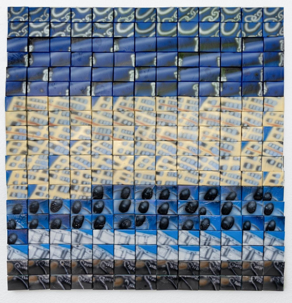 Grid made up of dozens of small rectangular canvases, including closeup images of of a building with lots of windows, creating an abstract composition in blue, yellow, and black