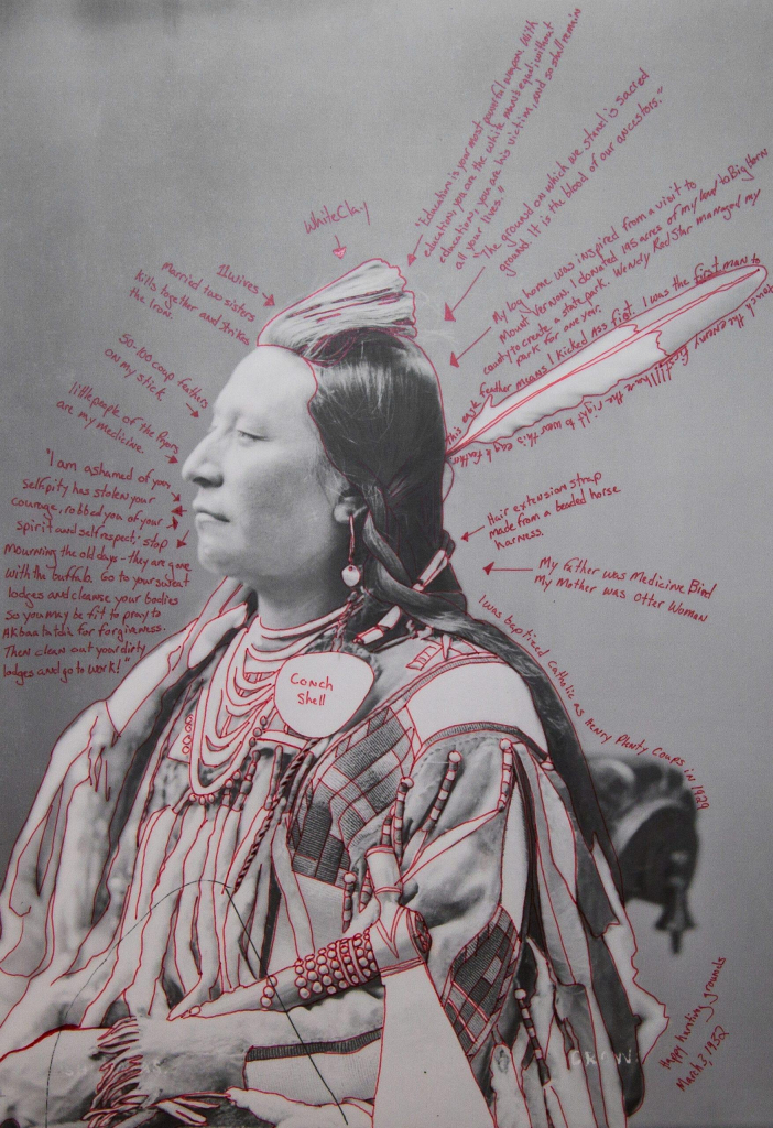 Black and white photo portrait of a Crow chief, with notes in red pen added identifying different aspects of his clothing and additional symbols, along with some hypothetical observations