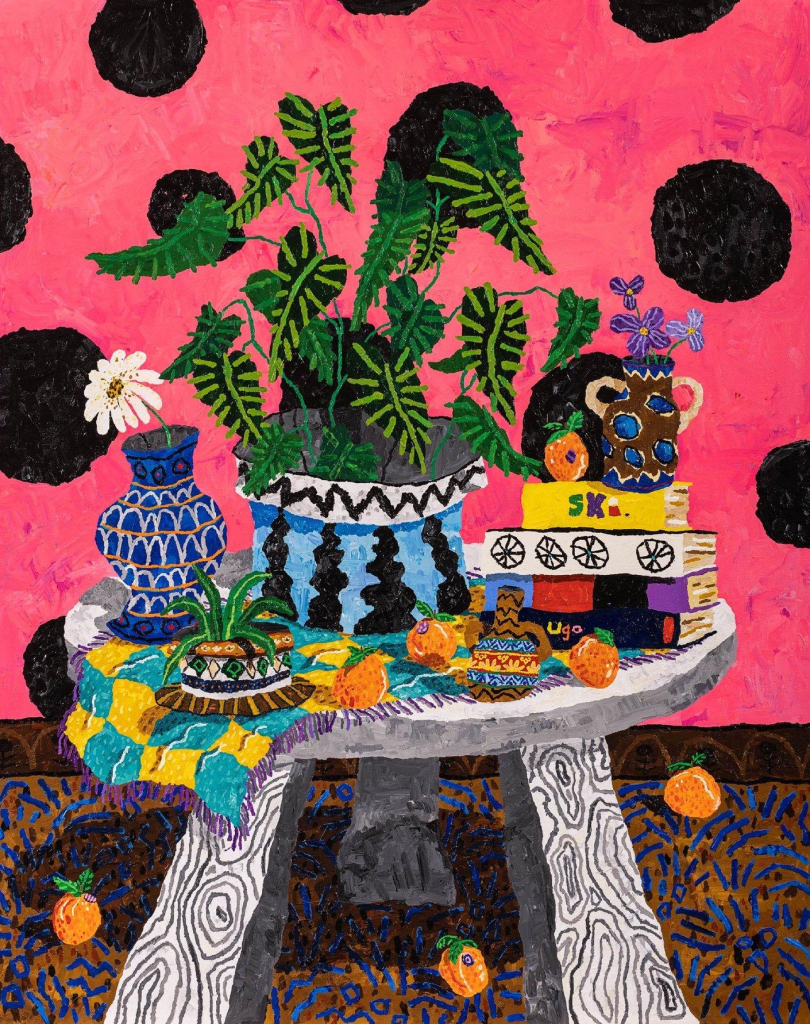 Painting of a small white wood table holding vases with green plants, a stack of books, and orange strewn over the surface and floor. The wall is pink with large black dots