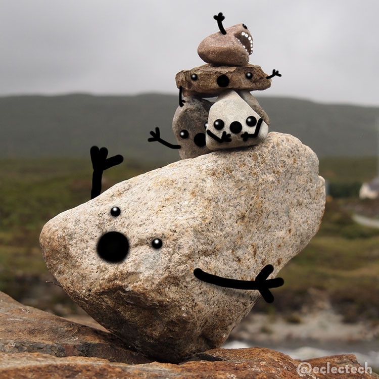 A square photo of a large rock balanced on a point on top of a large flat boulder. On top of the balancing rock are 4 more smaller rocks piled up. Behind them the blurred landscape of a grey day on the Isle of Skye. The rocks all have faces and arms added, with surprised expressions, as if the balancing rock is mid-topple.

No rocks were harmed during the making of the picture.