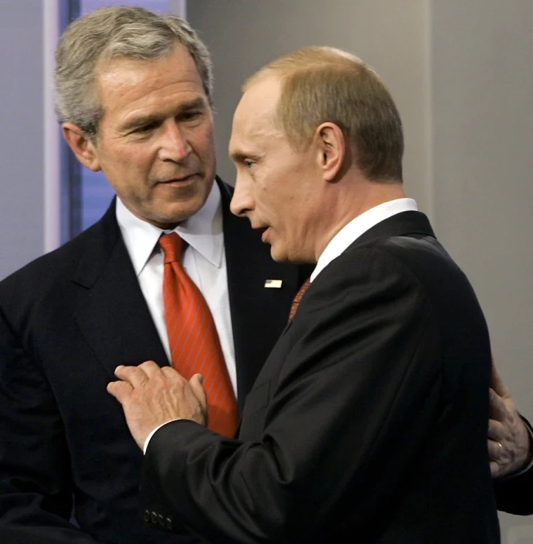 Two war criminals together, Georg W. Bush and Vladimir Putin, back when they had their short lived honeymoon.