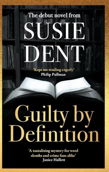 The image shows the cover of a book titled "Guilty by Definition," the debut novel from Susie Dent. The background features bookshelves, and there are quotes from Philip Pullman and Janice Hallett on the cover.