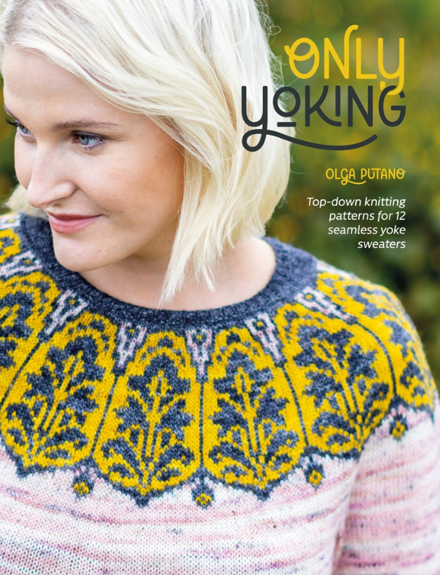 A picture of a book cover. A blonde woman looks off camera while wearing a yellow and blue very detailed yoke-style sweater. The body of the sweater is solid pinkish-white. The book of knitting patterns is called "Only Yoking - Top-down knitting patters for twelve seamless yoke sweaters"