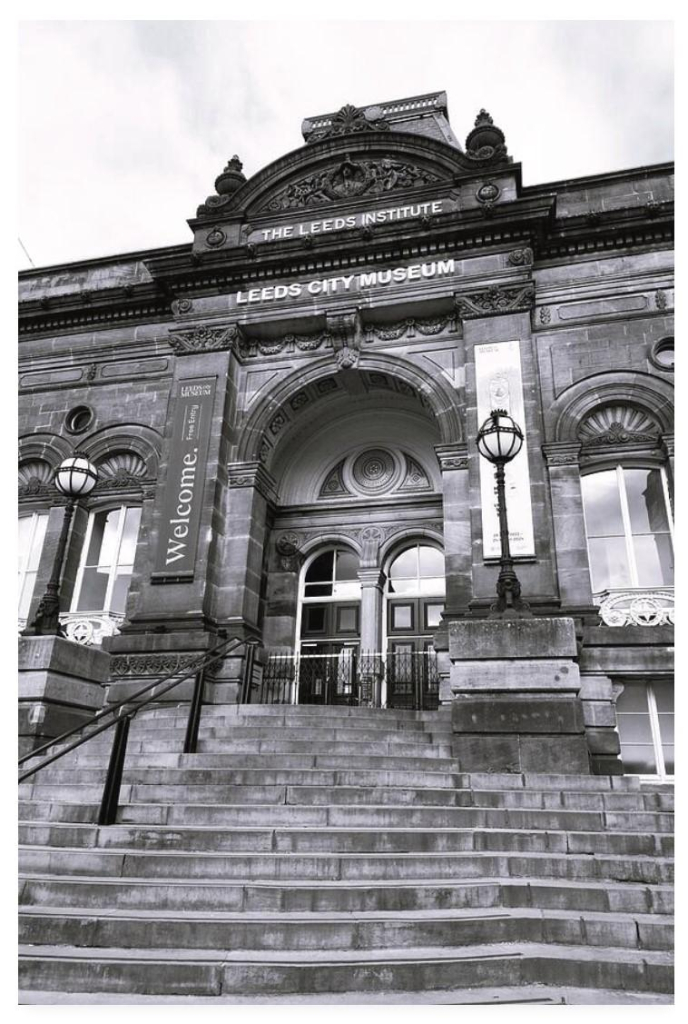 Black and white portrait photograph showing steps leading up to the entrance of the grand looking Leeds City Museum.