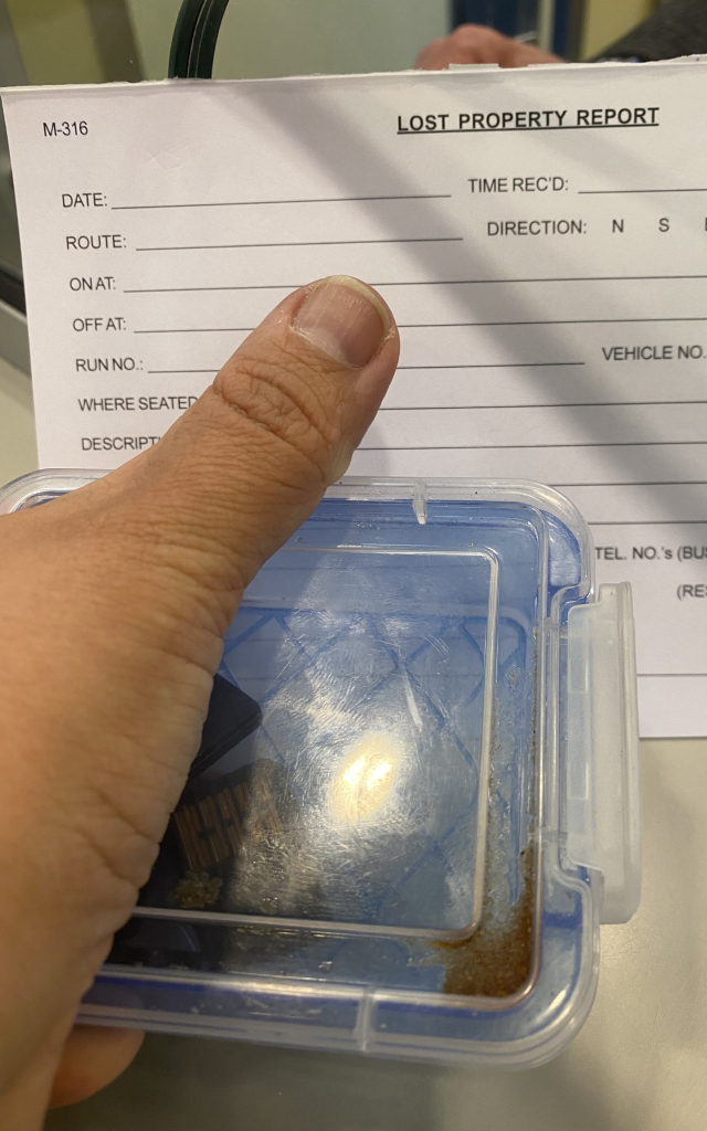 Small blue plastic box of Nintendo Switch games being turned into TransLink’s Lost Property Office. 

The background is a blank Lost Property Report.