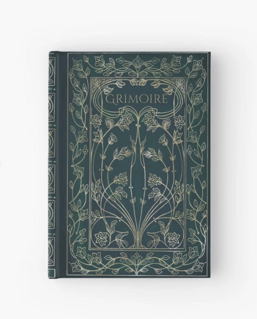 The front cover of an emerald green garden Grimoire has a plant design in white and gold line drawings. The title is Grimoire in fancy ornate font. 