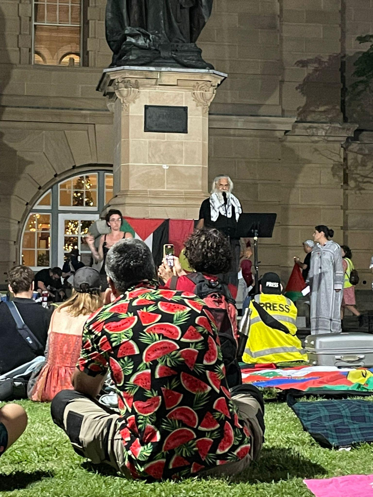 An aboriginal elder speaks at the pro Palestine rally in Magandjin