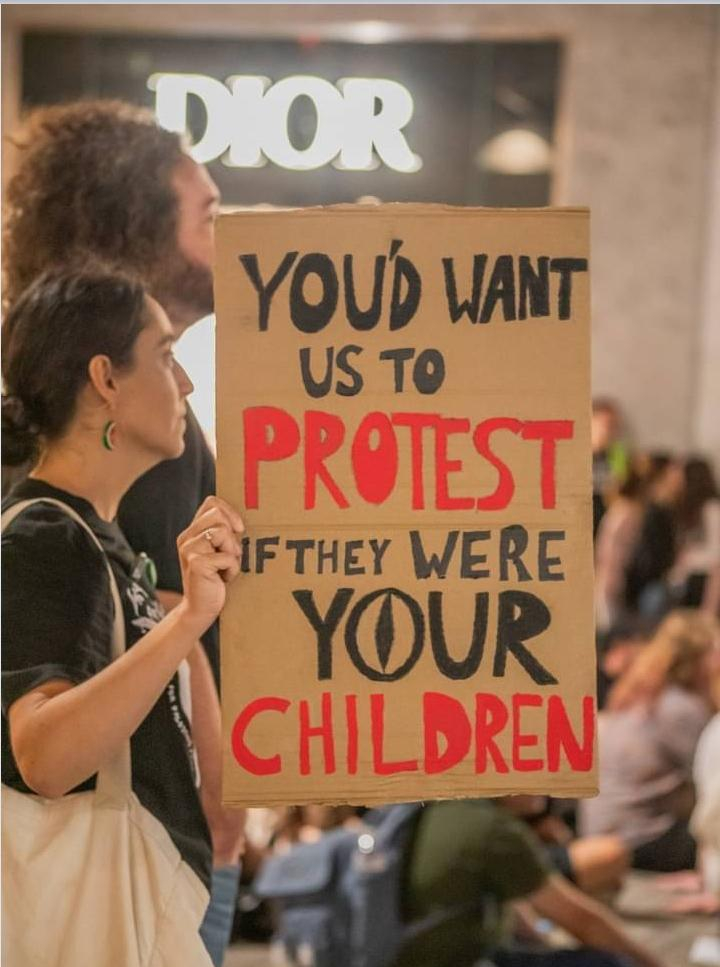 A sign that reads: "you'd want us to protest if they were your children"