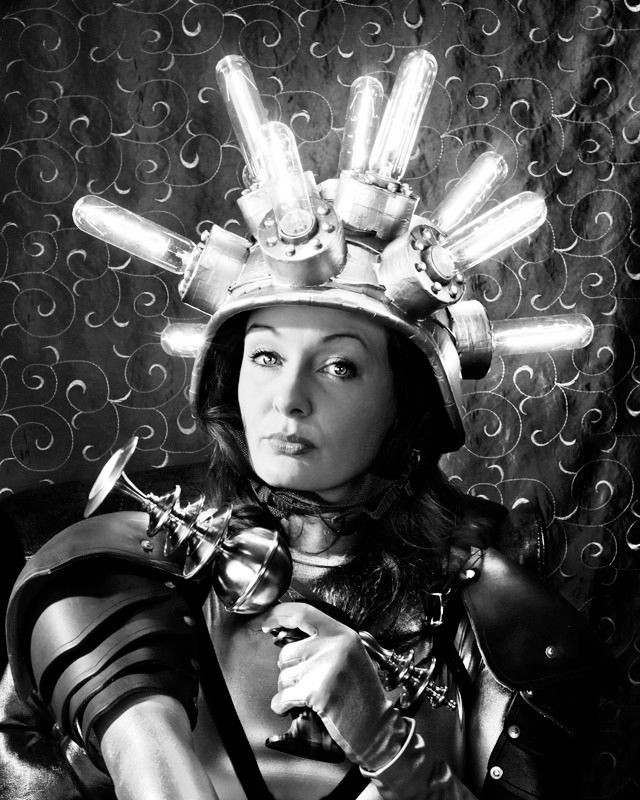 a woman from an old 50s style scifi movie, wearing a hat studded with glowing tubes and holding a cool looking raygun