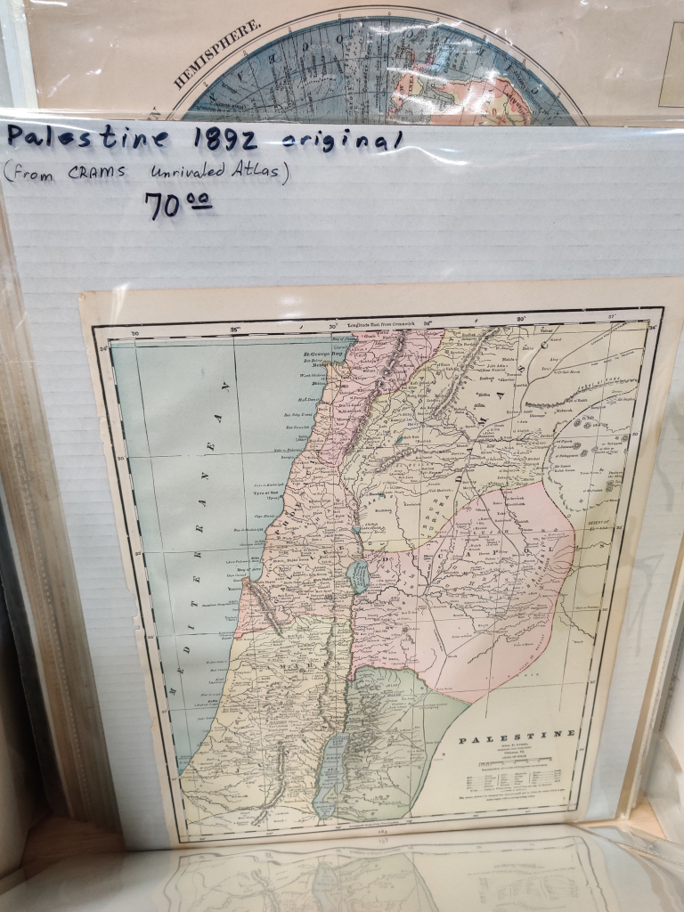 map on beige paper inside a plastic sleeve - handwriting on plastic reads palestine 1892 original from Crams Unrivaled Atlas $70 