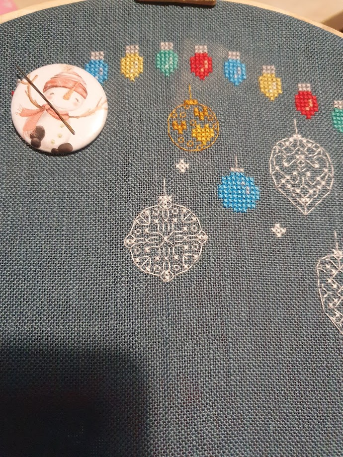 The next addition to the Baubles and Fairy Light Cross stitch is a delicate white bauble, mostly done in backstitch with a few complete crosses, another round bauble. Blurry photo because I'm feeling a bit shaky. 