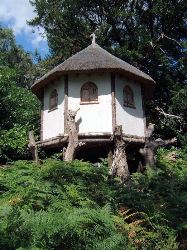 The restored hermitage at Painshill Park Rictor Norton and David Allen via Wikimedia Commons under CC BY 2.0

It's an old, tiny house with a pointed roof, nestled in a lush garden, and raised off the ground by wooden stilts. 