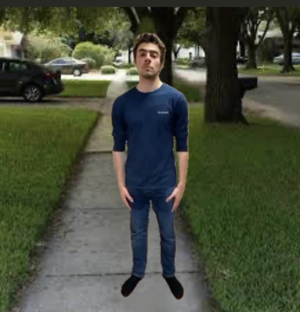 A photo of Luigi Mangione standing looking at the camera. The background is from the "You know he had to do it to em" meme.