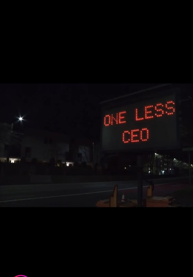 A highway sign showing the words “ONE LESS CEO”, near Dexter Avenue, Seattle 