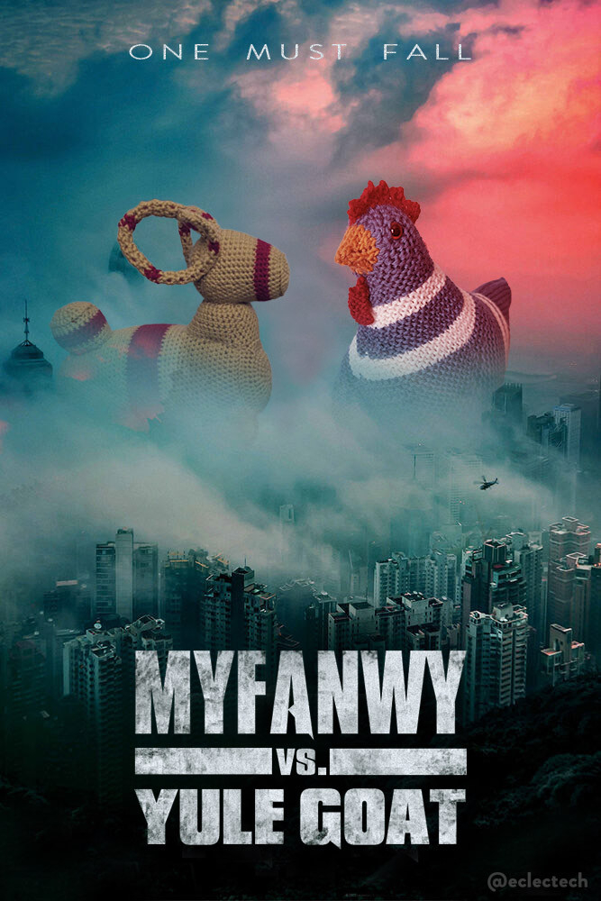 A parody poster of Godzilla vs. Kong, where the two of them are looming HUGE behind a grimy blue-grey cityscape, helicopter flying over, fiery clouds on the top tight lighting up Kong in the original. The title is in slightly metallic grimy text at the bottom.

Here the title has been changed to Myfanwy vs. Yule Goat. The two characters have been changed to large knitted creations. On the right, tinged red, is Myfanwy the teal and cream knitted chicken. On the left a large knitted Yule Goat, a mustard yellow with red stripes. At the top it reads ONE MUST FALL.

I would watch.