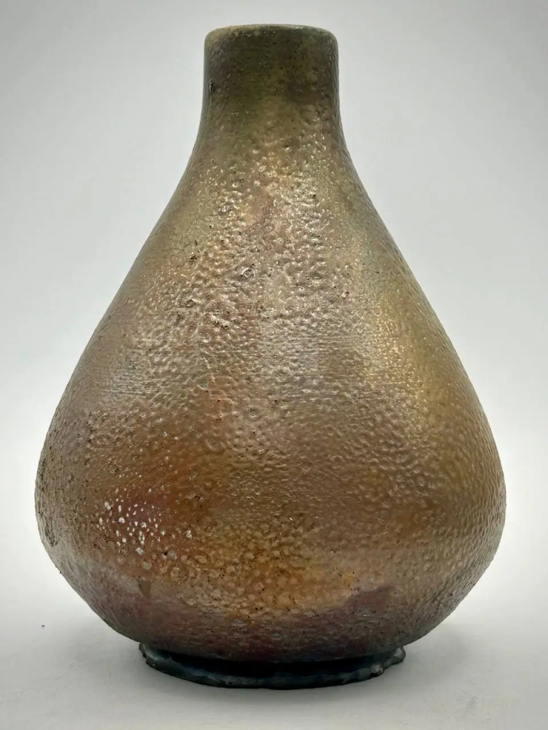 A metallic, bronze/gold textured raku pottery vase called 'Hephaestus' Forge'