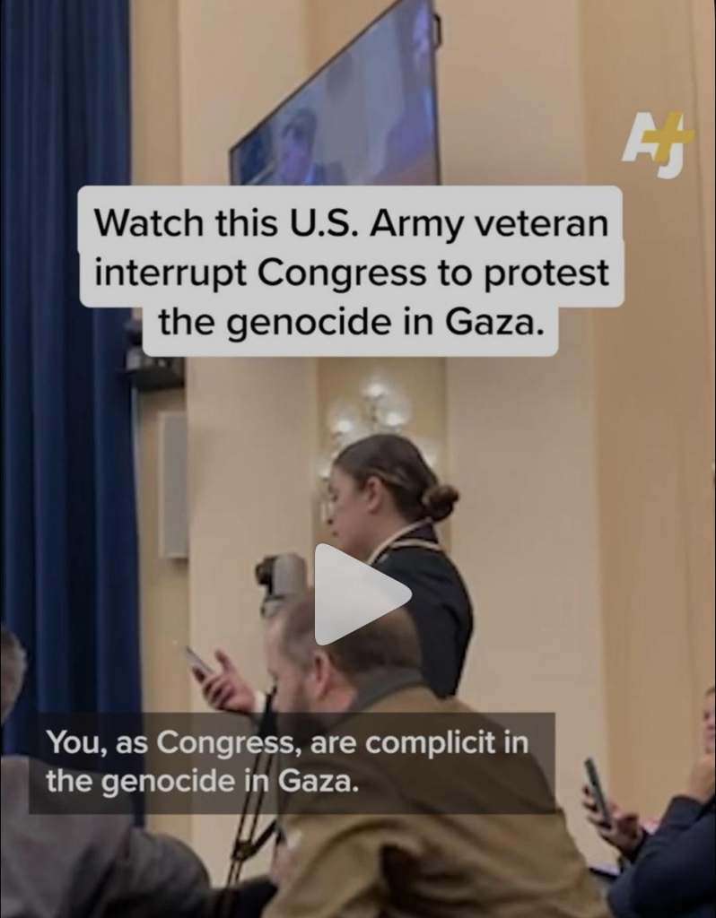 Josephine Guilbeau protesting at a congressional hearing on veteran affairs.