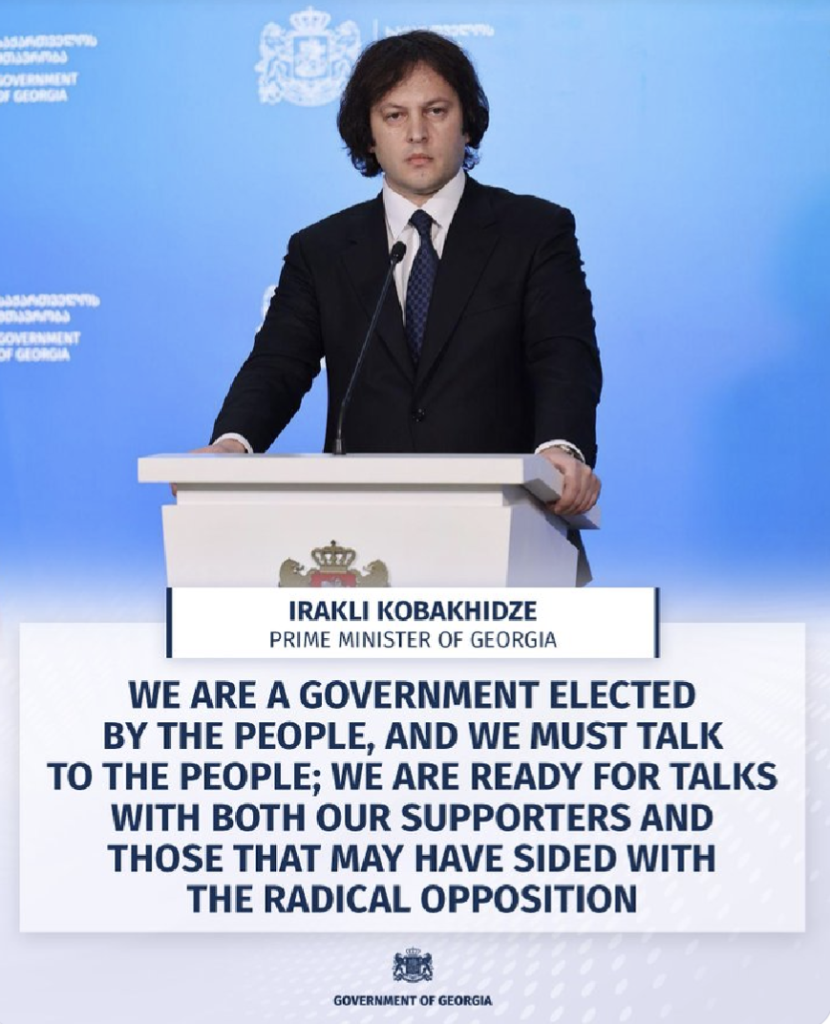 Georgian government press release showing PM Khobakidze standing at a lectern.


"We are a government elected by the people, and we must talk to the people. We are ready for talks with both our supporters and those that may have sided with the radical opposition."