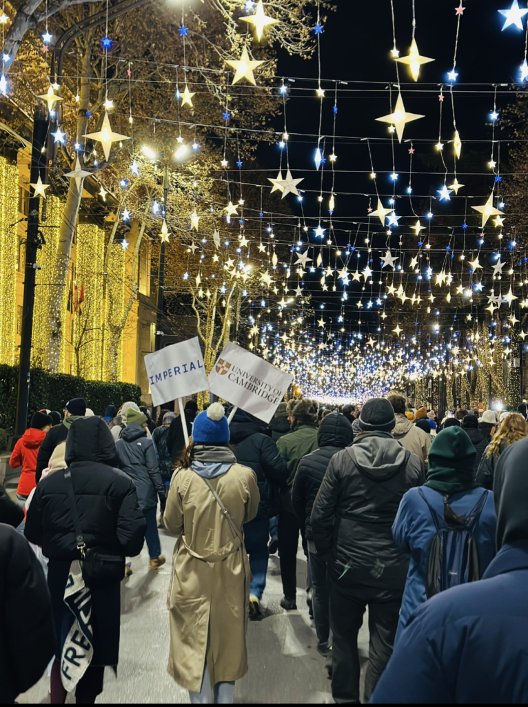 Tbilisi, Georgia. A University Society protestor marches with an Imperial College, Cambridge sign.