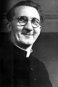 Head and shoulders portrait of Hugh O’Flaherty in his priest's cassock and clerical collar.