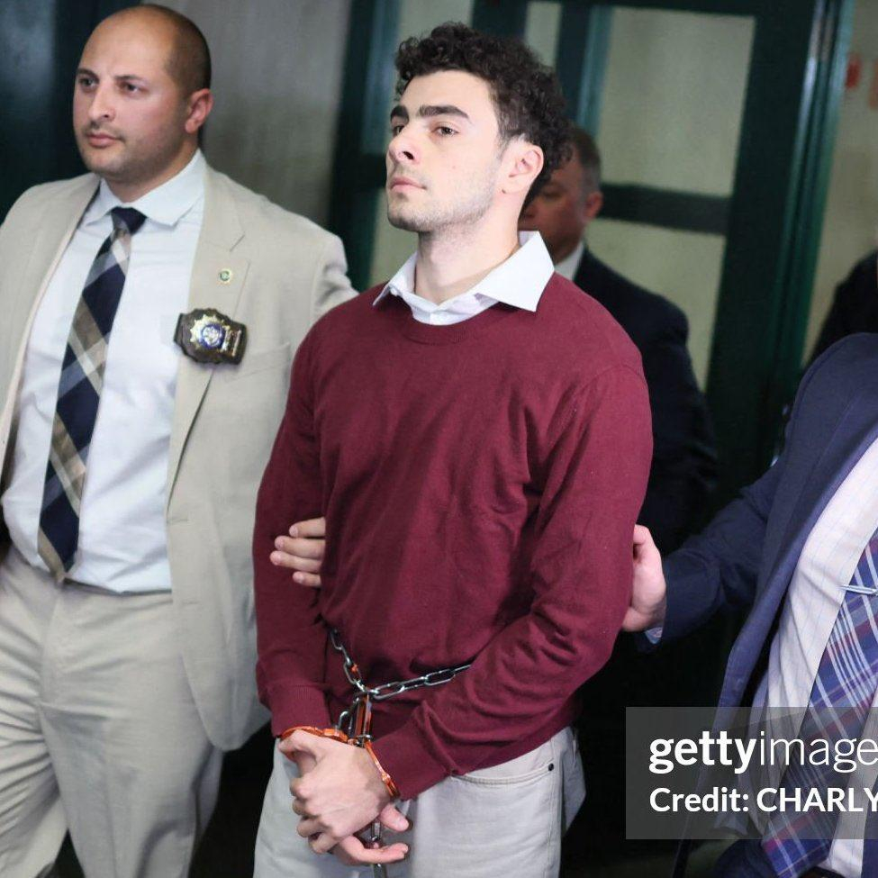 Luigi Mangione in handcuffs 