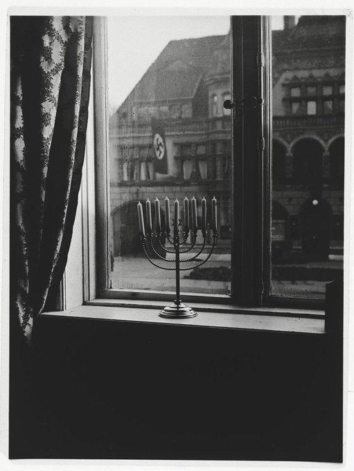 During Hanukkah in 1931, Rabbi Akiva Posner’s family placed a menorah in the window—an outward sign of their faith. 