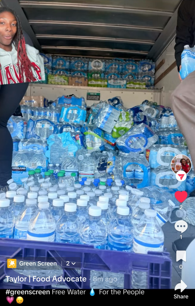 Water bottle packages packed into the back of a delivery truck headed to free fridges.