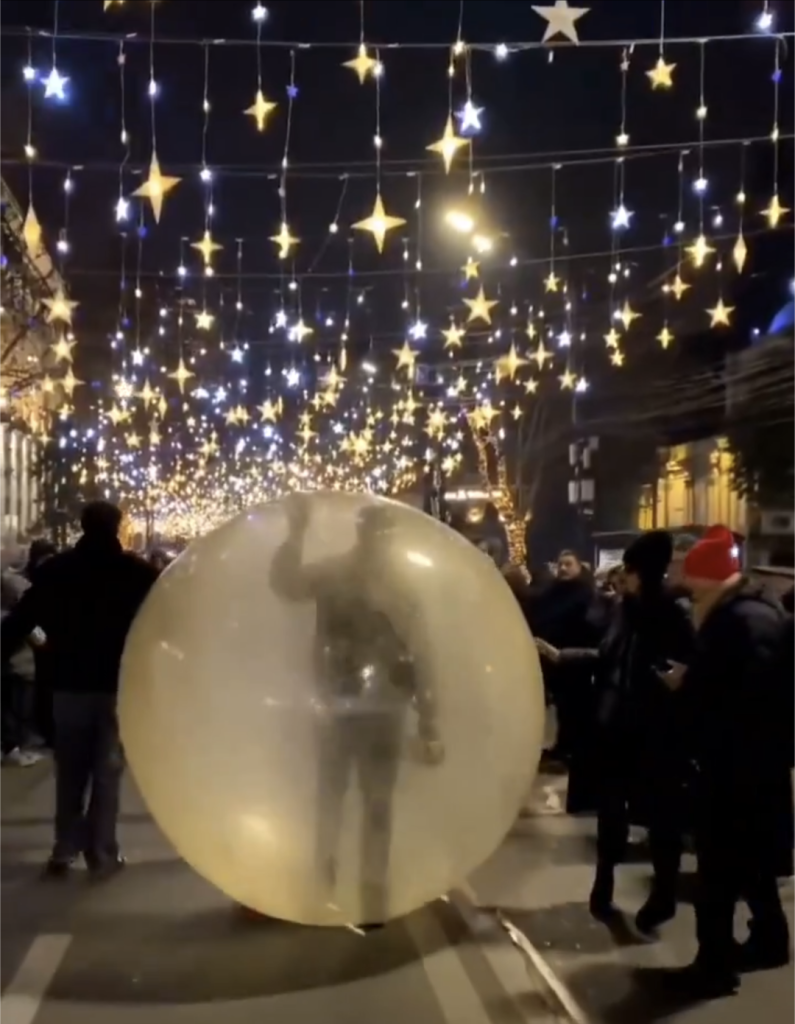 Protestors in Tbilisi, Georgia, walking in a giant plastic bubble to conceal their identity.