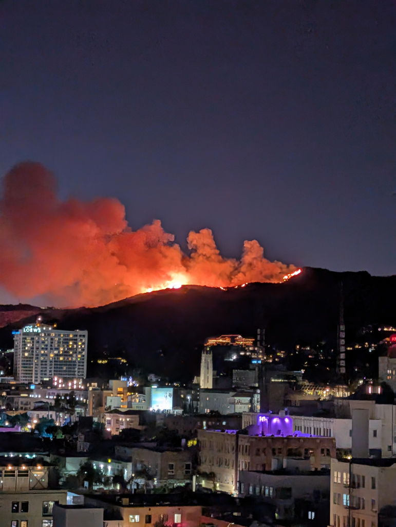 A photo taken from pour apartment. A fire (known as the Sunset Fire) rages in the Hollywood Hills. Yamashiro and the Lowes Hotel next to Hollywood Ovation are visible, at a distance from the fire.