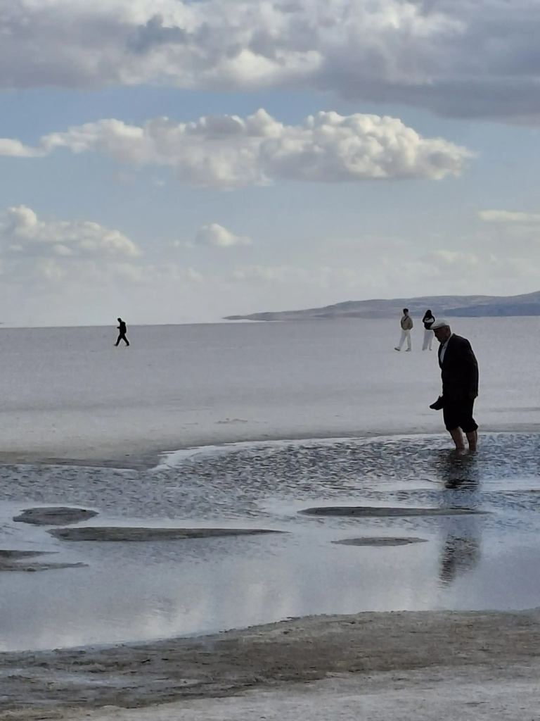 People walking on a salty lake in Turkey.