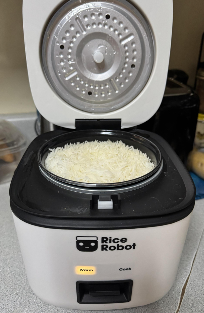 A photo of my Rice Robot with white rice in it. 